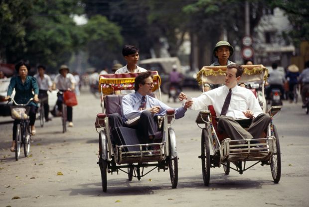 Businessmen on Hanoi cyclo